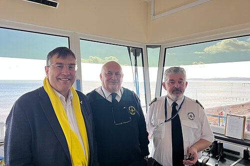 Image of 3 men in a coastwatch station