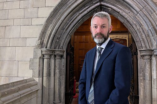 Will in front of door in Parliament