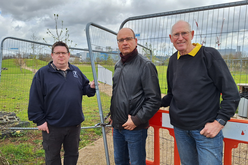John, Olaf and David by the fence to the closed park