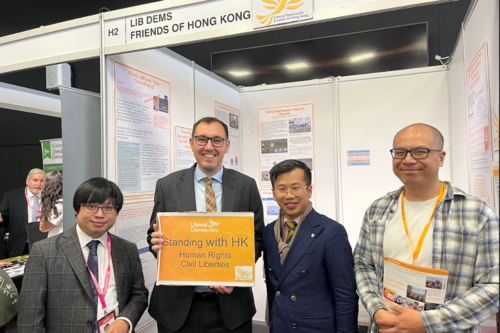 Tom Gordon MP with Standing with Hong Kong sign - with people from HK