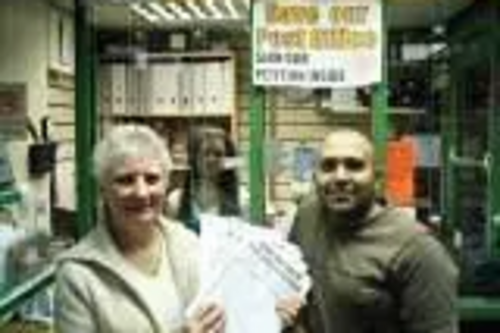 Jay Patel from Buersil Post Office and local resident Pat Colclough with petitions