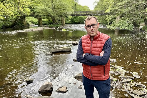 Tom Gordon MP stood by river Nidd