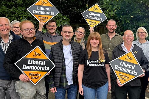 Group of local Liberal Democrat campaigners in North East Lincolnshire holding “Winning Here” signs during the 2026 local election campaign