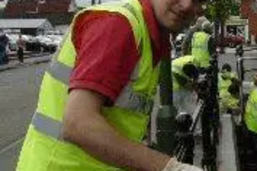 David Goodall painting along side the Millennium Volunteers