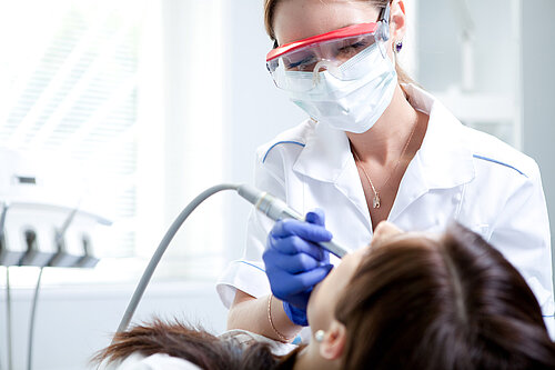 A dentist treating a patient
