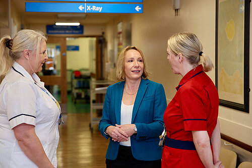 Helen listens to nurses at local hospital