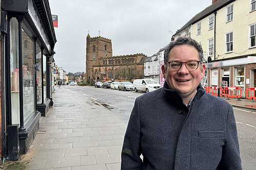 David Ellams standing in front of St Nicholas's Church on Newport High Street.